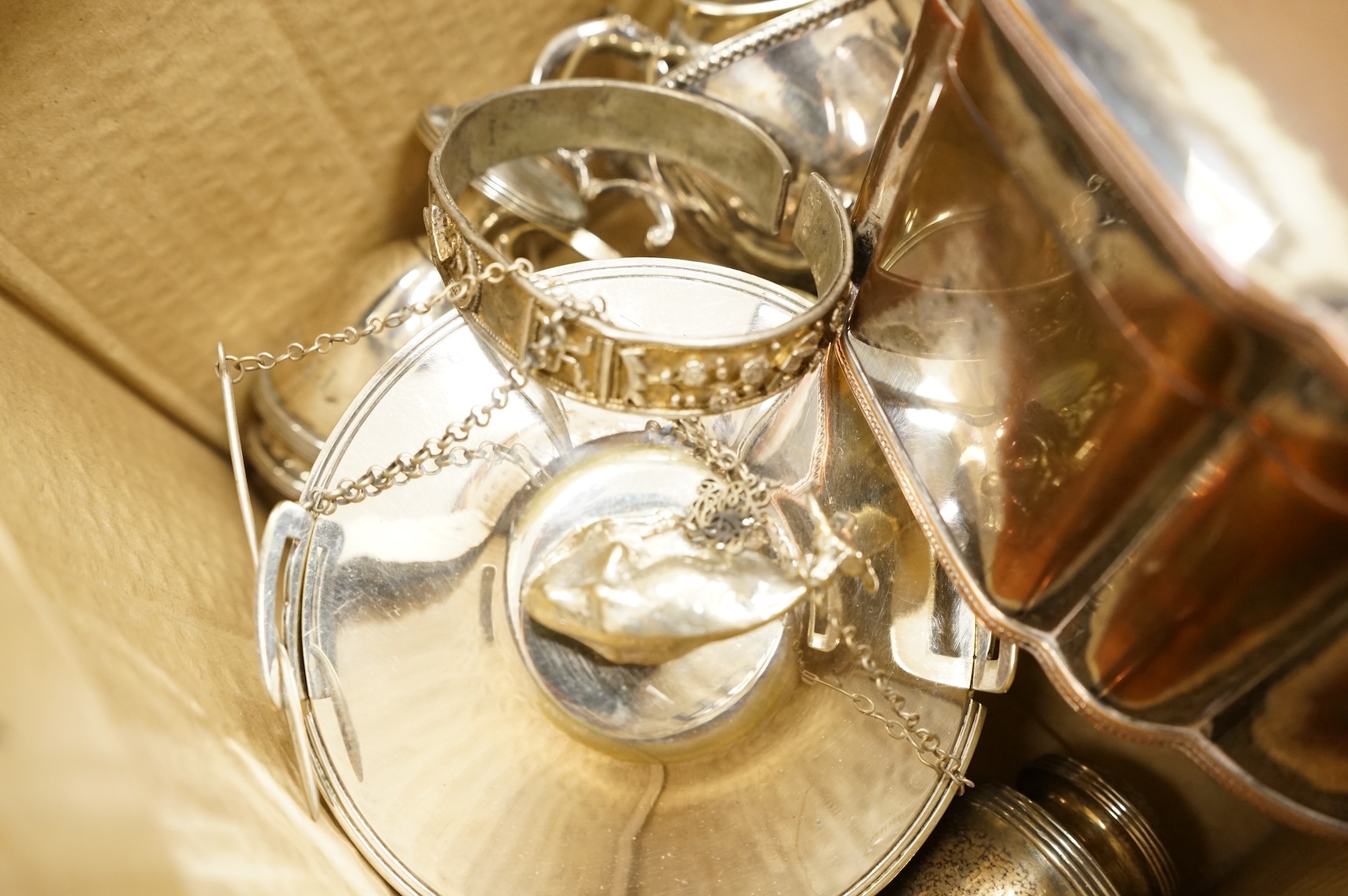 A quantity of assorted plated wares, including flatware, a tea caddy, a chatelaine, a toast rack, a sauceboat, a butter dish and a pair of candlesticks, etc.